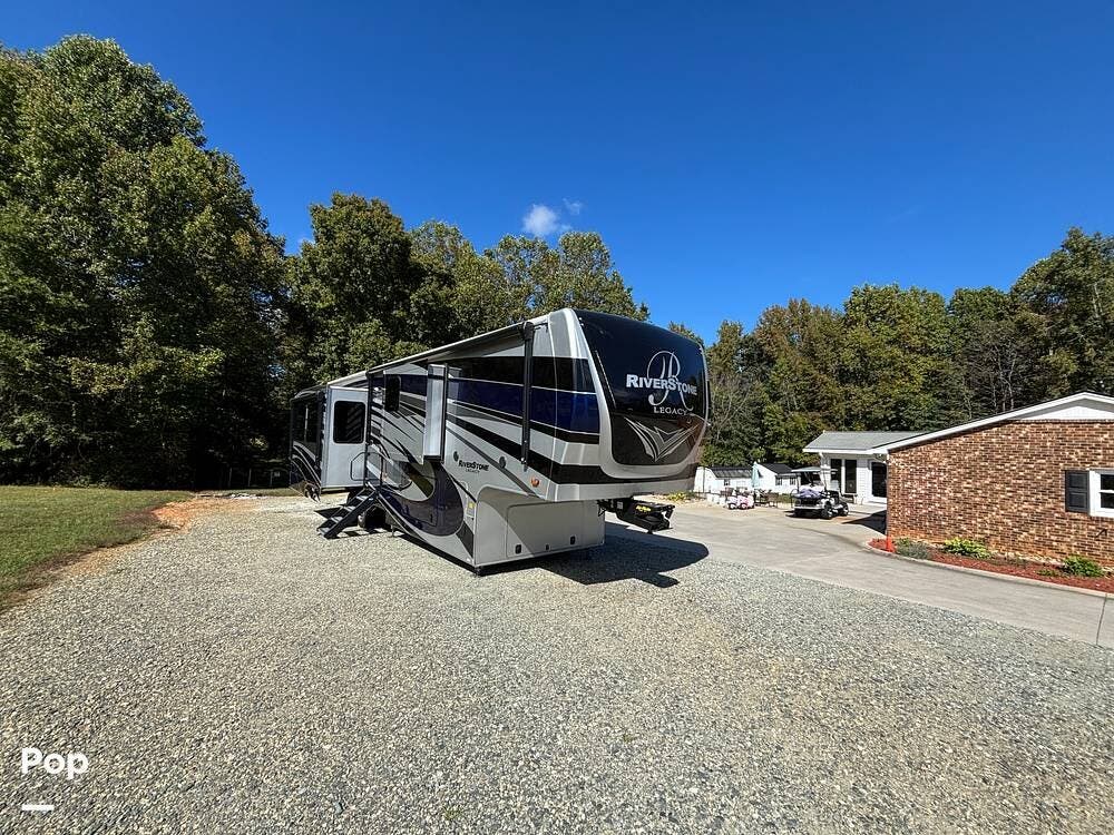 Call now about this 2021 Forest River RiverStone 39RKFB! 2021 Forest River RiverStone 39RKFB - Used Toy Hauler For Sale by Pop RVs in Climax, North Carolina features Leveling Jacks, Air Conditioning, Slideout, Awning