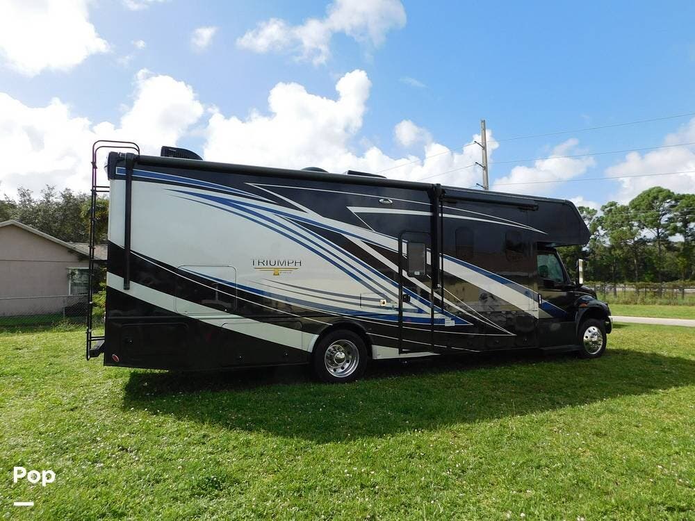 Call now about this 2022 Nexus Triumph 33TSC! 2022 Nexus Triumph 33TSC - Used Super C For Sale by Pop RVs in Port Saint Lucie, Florida features Leveling Jacks, Awning, Generator, Air Conditioning, Slideout