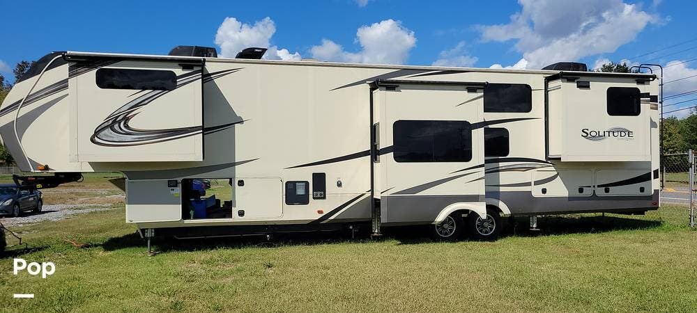 Call now about this 2020 Grand Design Solitude 390RK-R! 2020 Grand Design Solitude 390RK-R - Used Fifth Wheel For Sale by Pop RVs in White Pine, Tennessee features Air Conditioning, Awning, Slideout, Leveling Jacks, Generator