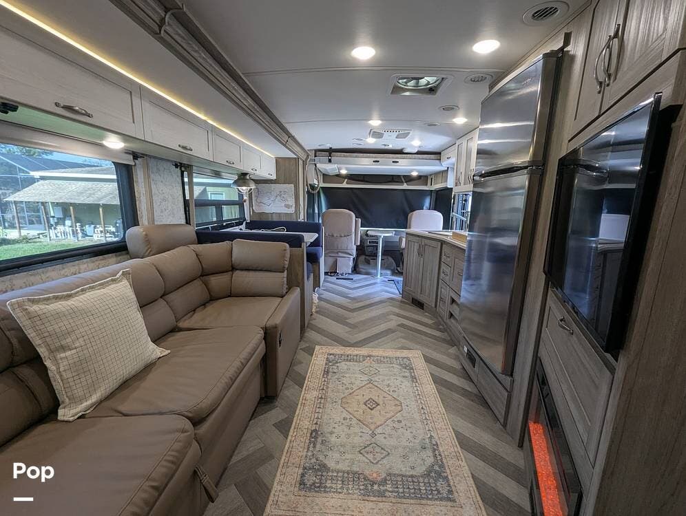 Call now about this 2023 Winnebago Adventurer 35F 30th Anniversary Edition! 2023 Winnebago Adventurer 35F 30th Anniversary Edition - Used Class A For Sale by Pop RVs in Lithia, Florida features Leveling Jacks, Awning, Air Conditioning, Slideout, Generator