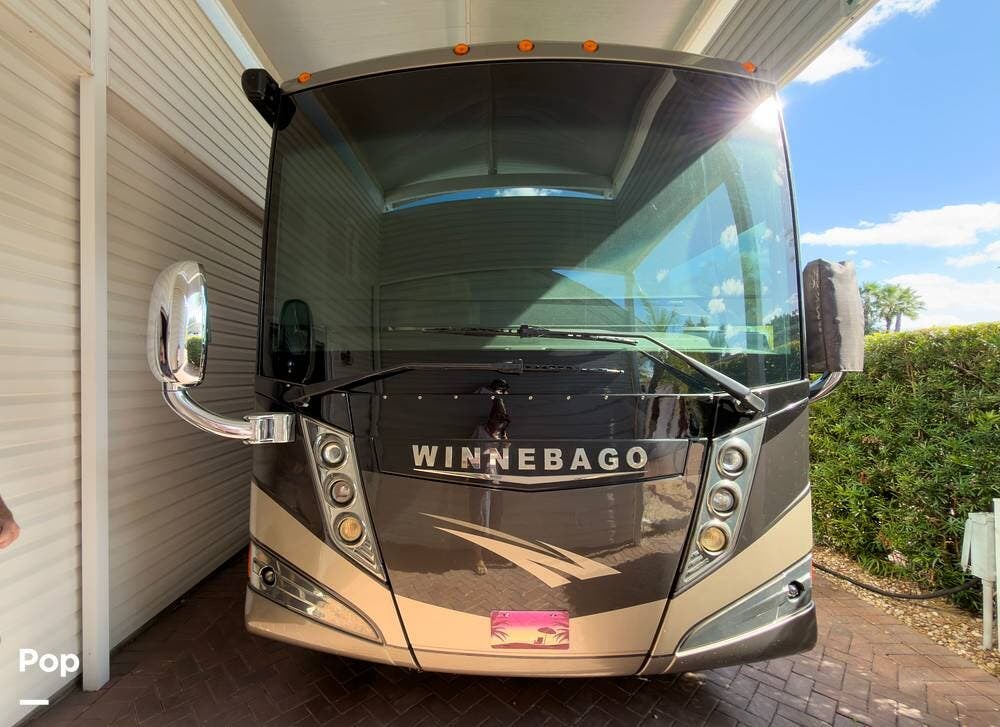 Call now about this 2013 Winnebago Tour 42QD! 2013 Winnebago Tour 42QD - Used Diesel Pusher For Sale by Pop RVs in Davenport, Florida features Slideout, Leveling Jacks, Generator, Air Conditioning, Awning
