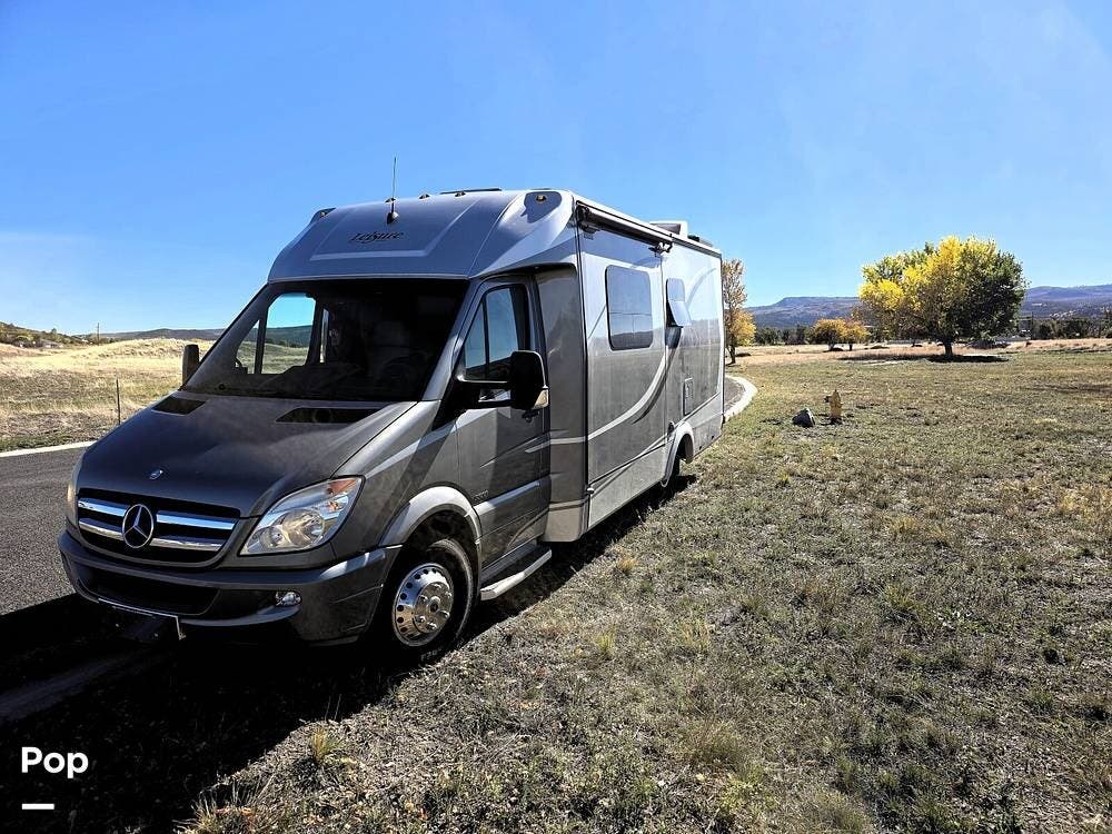 Call now about this 2013 Leisure Travel Unity U24MB! 2013 Leisure Travel Unity U24MB - Used Class C For Sale by Pop RVs in Eagar, Arizona features Slideout, Generator, Awning, Air Conditioning