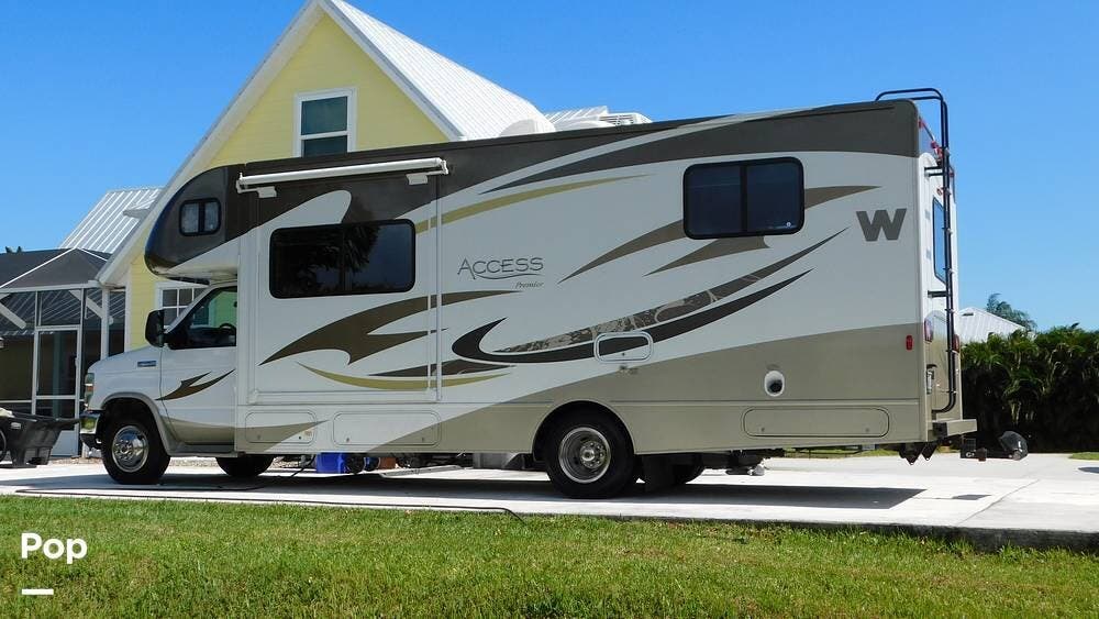 Call now about this 2013 Winnebago Access 26QP! 2013 Winnebago Access 26QP - Used Class C For Sale by Pop RVs in Vero Beach, Florida features Awning, Air Conditioning, Slideout, Generator