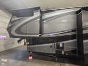 Call now about this 2022 Grand Design Momentum 397TH-R! 2022 Grand Design Momentum 397TH-R - Used Toy Hauler For Sale by Pop RVs in South Wales, New York features Slideout, Air Conditioning, Leveling Jacks, Generator, Awning