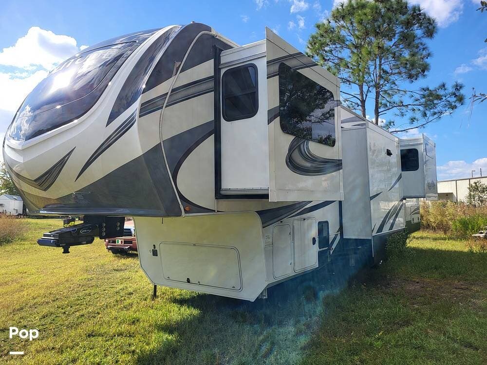 Call now about this 2022 Grand Design Solitude 380FL-R! 2022 Grand Design Solitude 380FL-R - Used Fifth Wheel For Sale by Pop RVs in Saint Cloud, Florida features Awning, Slideout, Air Conditioning, Leveling Jacks