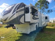 Call now about this 2022 Grand Design Solitude 380FL-R! 2022 Grand Design Solitude 380FL-R - Used Fifth Wheel For Sale by Pop RVs in Saint Cloud, Florida features Awning, Slideout, Air Conditioning, Leveling Jacks