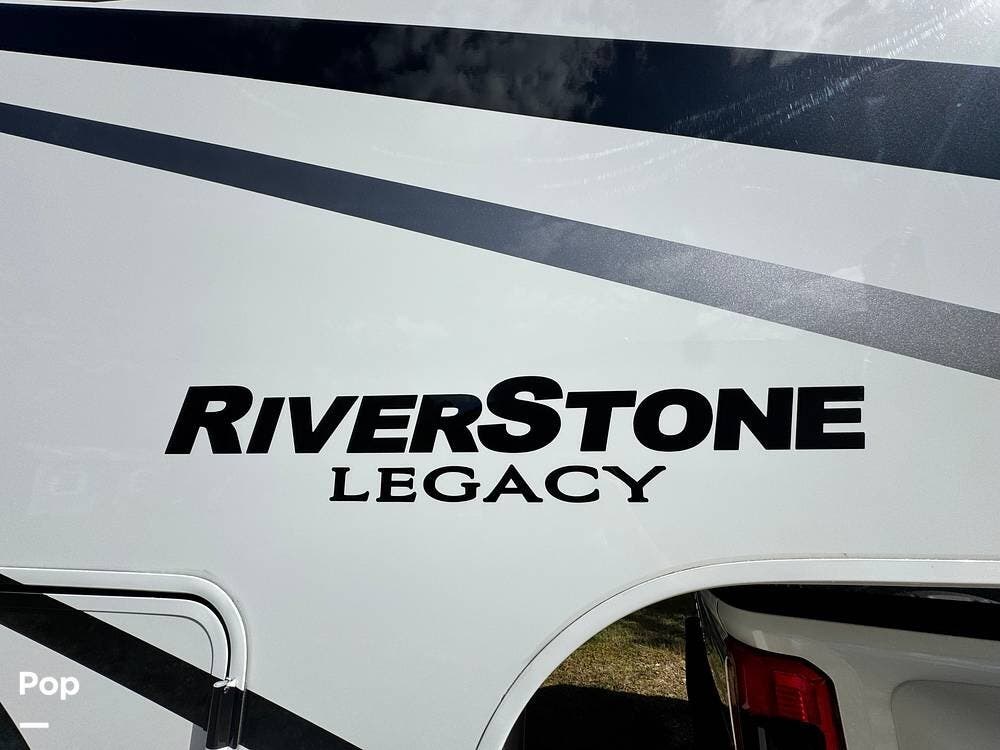 Call now about this 2023 Forest River RiverStone Legacy 39RKFB! 2023 Forest River RiverStone Legacy 39RKFB - Used Fifth Wheel For Sale by Pop RVs in Wesley Chapel, Florida features Awning, Air Conditioning, Slideout, Leveling Jacks