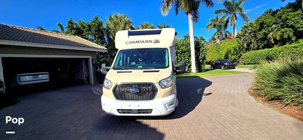 Call now about this 2021 Thor Motor Coach Compass 23TW! 2021 Thor Motor Coach Compass 23TW - Used Class C For Sale by Pop RVs in Delray Beach, Florida features Slideout, Air Conditioning, Generator, Awning