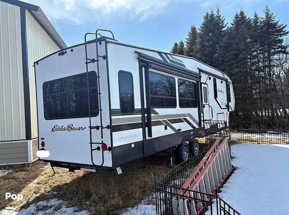 Call now about this 2024 Dutchmen Eddie Bauer 310RL! 2024 Dutchmen Eddie Bauer 310RL - Used Fifth Wheel For Sale by Pop RVs in Ham Lake, Minnesota features Awning, Air Conditioning, Leveling Jacks, Slideout