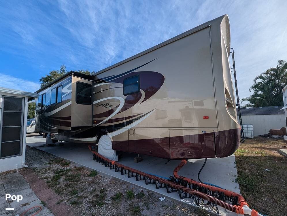 Call now about this 2013 Newmar Canyon Star 3610! 2013 Newmar Canyon Star 3610 - Used Class A For Sale by Pop RVs in Palmetto, Florida features Generator, Air Conditioning, Slideout