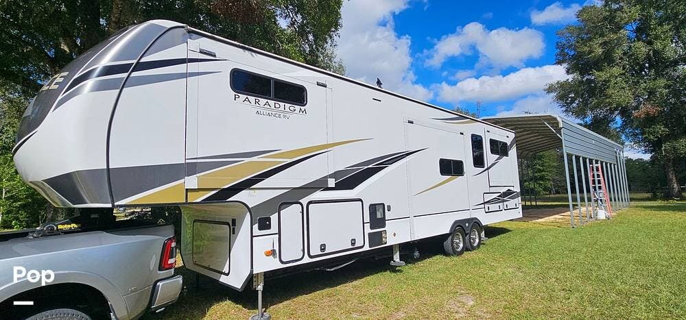 Call now about this 2021 Alliance RV Paradigm 365RD! 2021 Alliance RV Paradigm 365RD - Used Fifth Wheel For Sale by Pop RVs in Williston, Florida features Slideout, Leveling Jacks, Air Conditioning, Awning