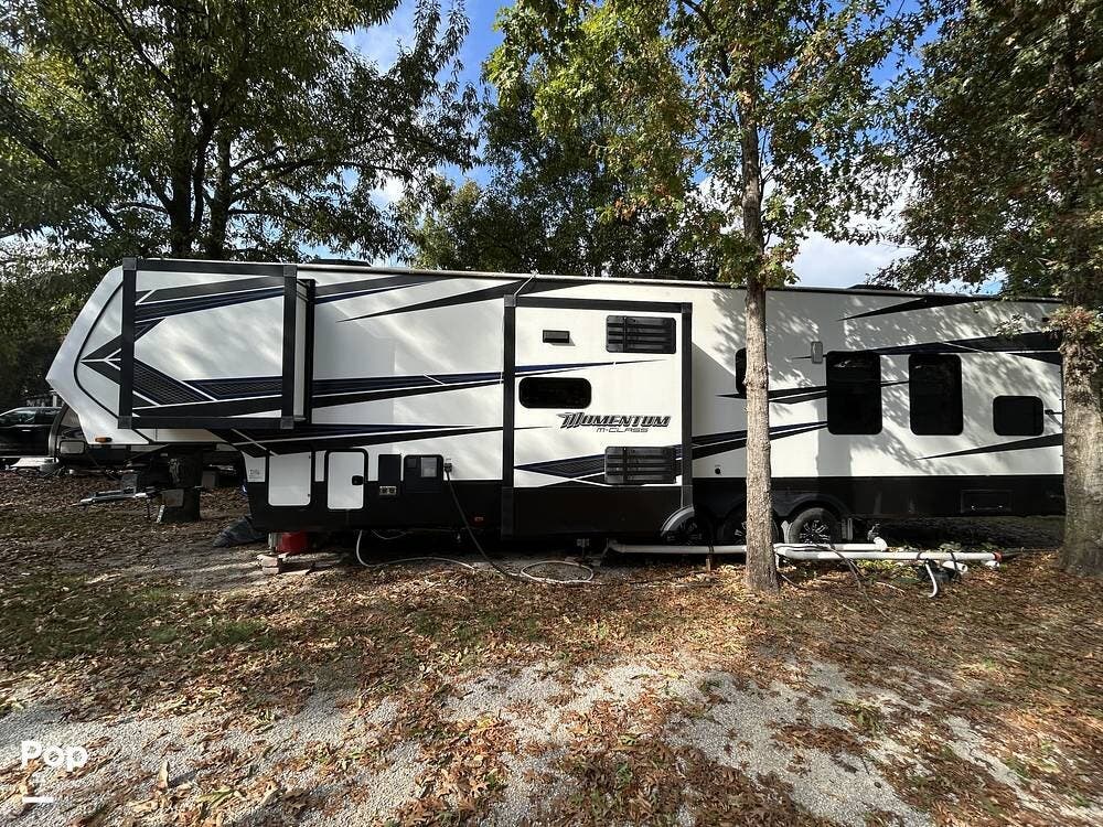 Call now about this 2020 Grand Design Momentum 381M! 2020 Grand Design Momentum 381M - Used Toy Hauler For Sale by Pop RVs in Azle, Texas features Slideout, Awning, Air Conditioning, Generator, Leveling Jacks