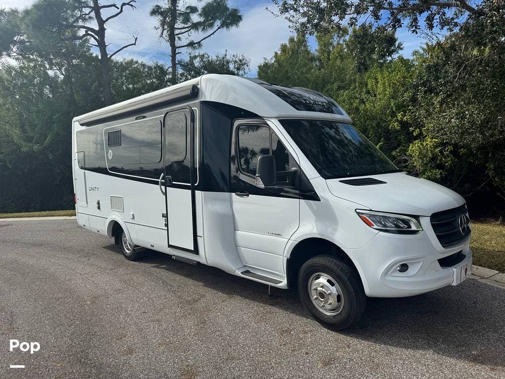 Call now about this 2020 Leisure Travel Unity U24MB! 2020 Leisure Travel Unity U24MB - Used Class C For Sale by Pop RVs in North Port, Florida features Slideout, Awning, Air Conditioning, Generator, Leveling Jacks