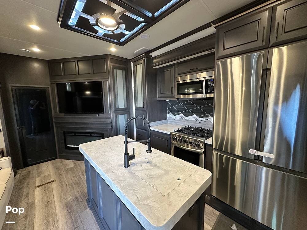 Call now about this 2022 DRV Full House LX455! 2022 DRV Full House LX455 - Used Toy Hauler For Sale by Pop RVs in Parrish, Florida features Air Conditioning, Generator, Slideout, Awning