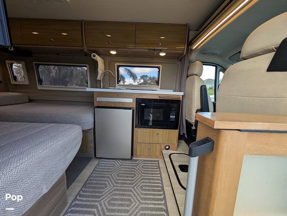 Call now about this 2021 Winnebago Travato 59K! 2021 Winnebago Travato 59K - Used Class B For Sale by Pop RVs in Palm Bay, Florida