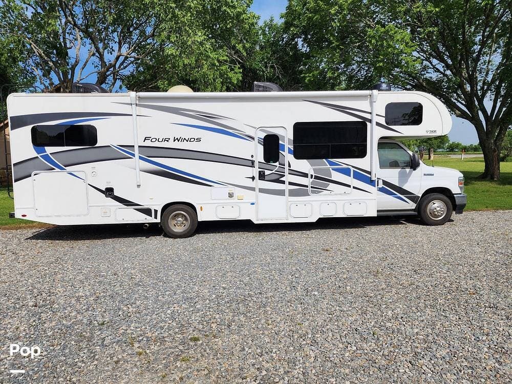 Call now about this 2022 Thor Motor Coach Four Winds 31E Bunkhouse! 2022 Thor Motor Coach Four Winds 31E Bunkhouse - Used Class C For Sale by Pop RVs in Gunter, Texas features Generator, Slideout, Air Conditioning