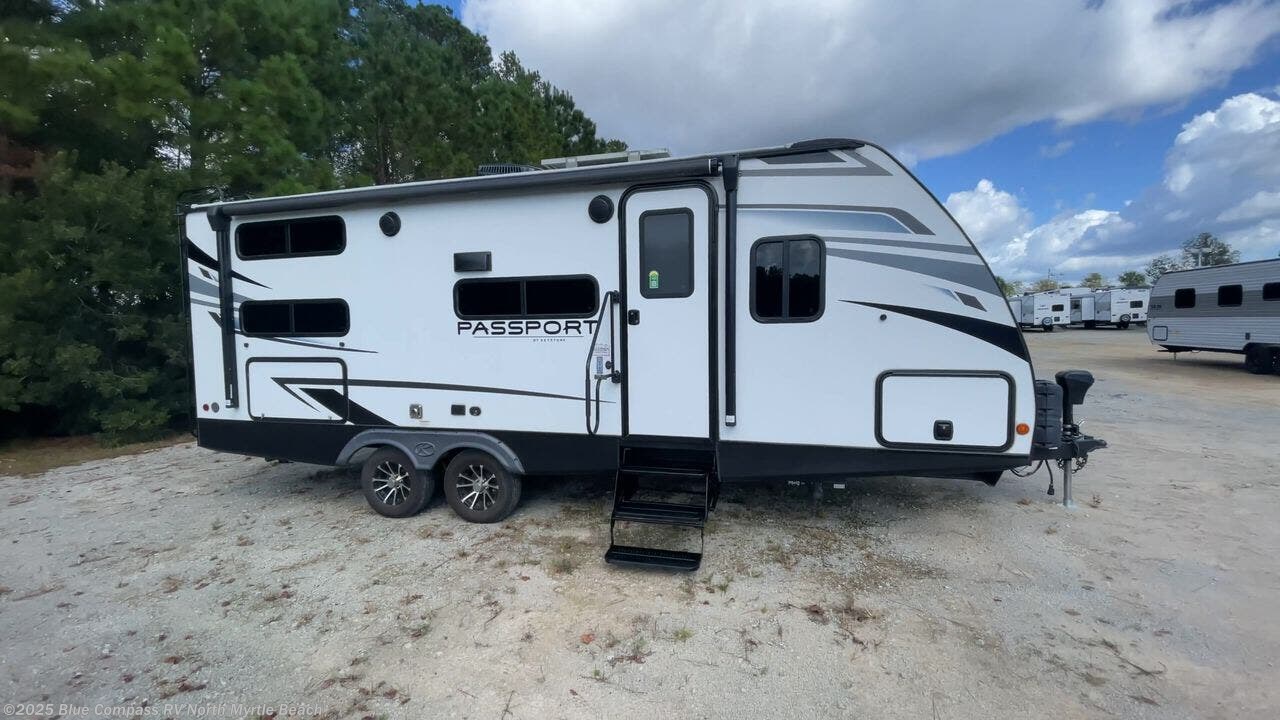 Contact us now about this 2022 Keystone Passport SL 221BH! 2022 Passport SL 221BH by Keystone from Blue Compass RV North Myrtle Beach in Longs, South Carolina