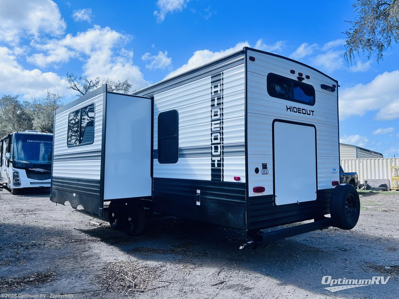 Call now about this 2025 Keystone Hideout 28BUS! 2025 Keystone Hideout 28BUS - New Travel Trailer For Sale by Optimum RV - Zephyrhills in Zephyrhills, Florida features Slideout, Awning