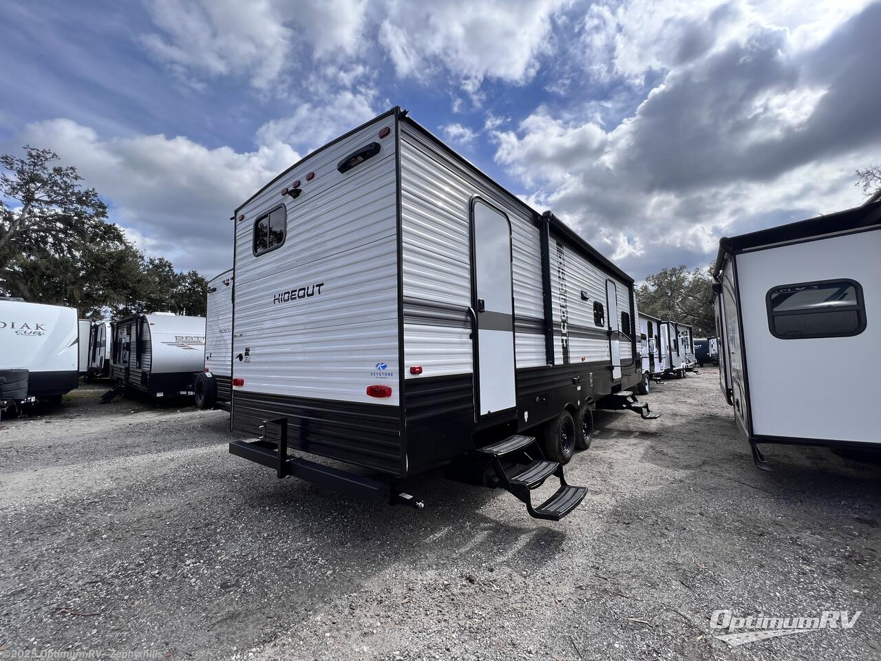 Call now about this 2025 Keystone Hideout Sport Double Axle 261BH! 2025 Keystone Hideout Sport Double Axle 261BH - New Travel Trailer For Sale by Optimum RV - Zephyrhills in Zephyrhills, Florida features Slideout