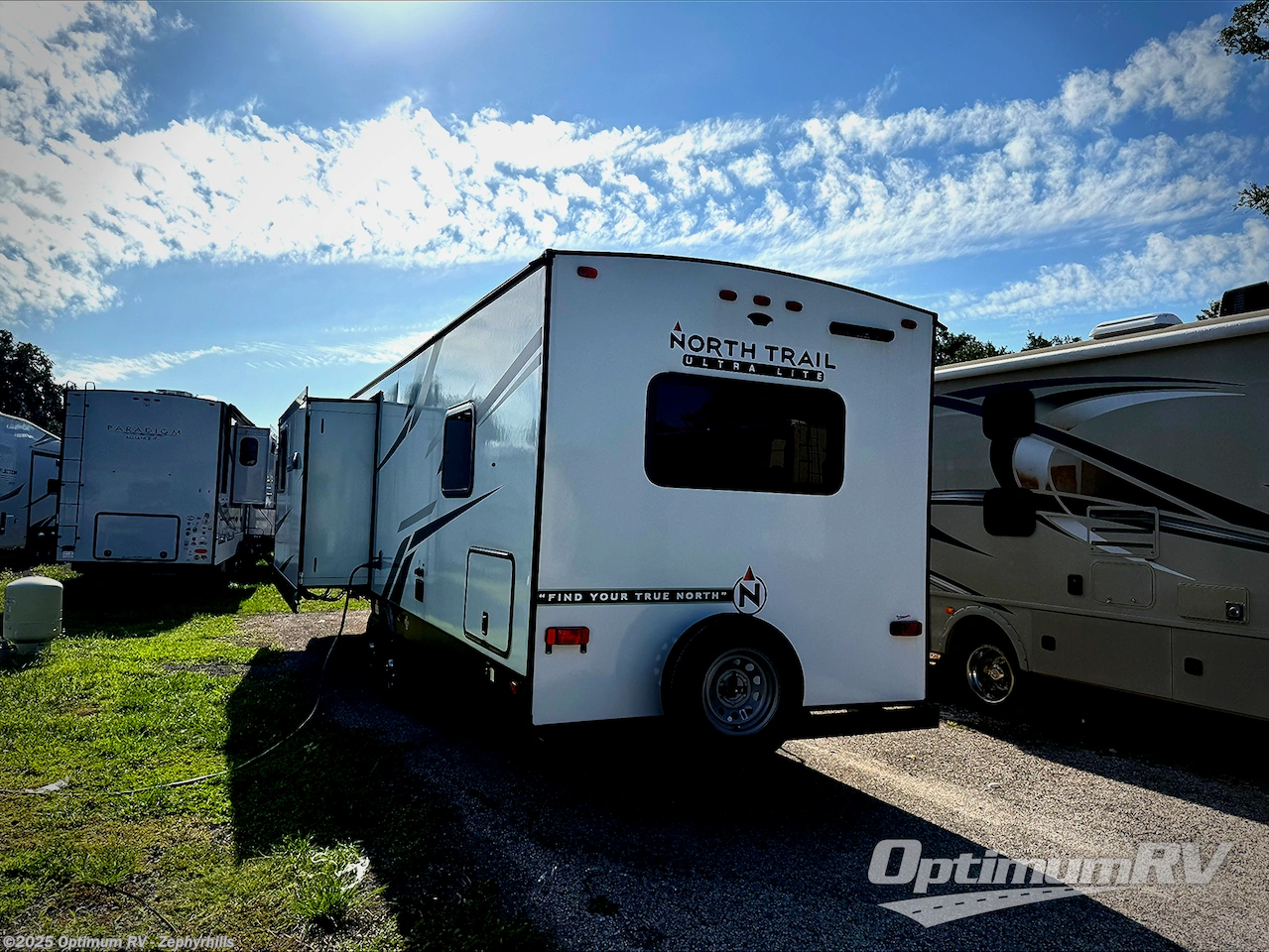 Call now about this 2023 Heartland North Trail 29FLR! 2023 Heartland North Trail 29FLR - Used Travel Trailer For Sale by Optimum RV - Zephyrhills in Zephyrhills, Florida features Slideout, Awning