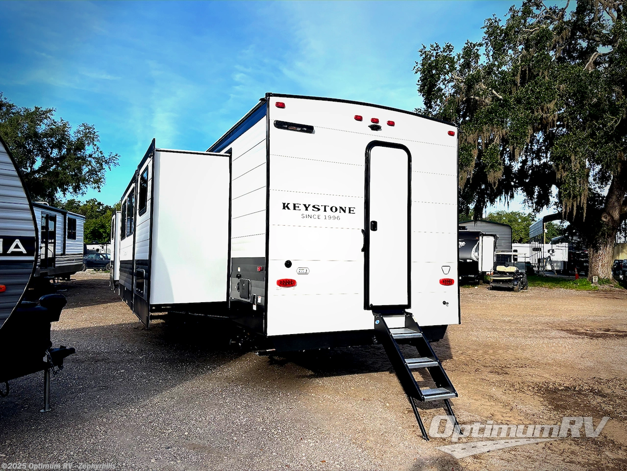 Call now about this 2026 Keystone Hideout 38DBD! 2026 Keystone Hideout 38DBD - New Destination Trailer For Sale by Optimum RV - Zephyrhills in Zephyrhills, Florida