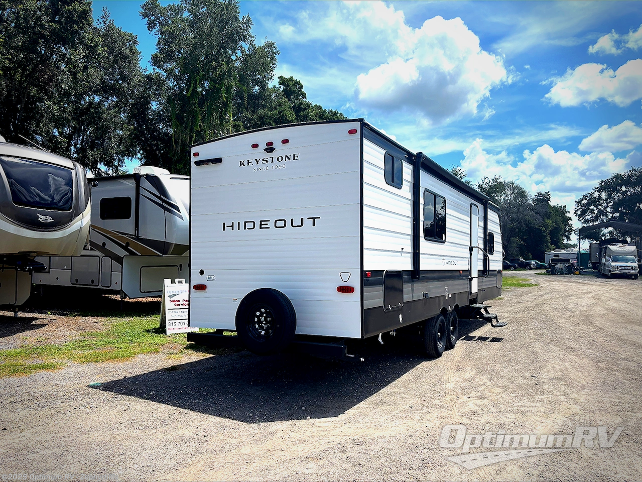 Call now about this 2026 Keystone Hideout Sport 291BR! 2026 Keystone Hideout Sport 291BR - New Travel Trailer For Sale by Optimum RV - Zephyrhills in Zephyrhills, Florida features Slideout, Awning