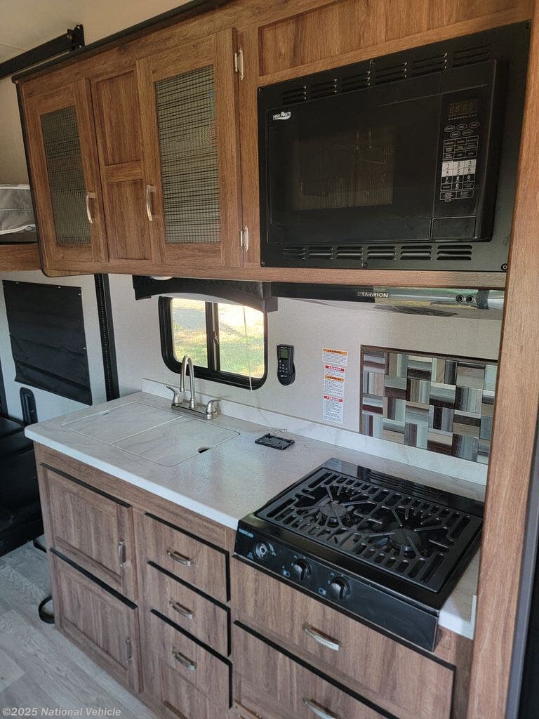 Call now about this 2019 Forest River Work and Play 25WQB! 2019 Forest River Work and Play 25WQB - Used Toy Hauler For Sale by National Vehicle in Miles City, Montana