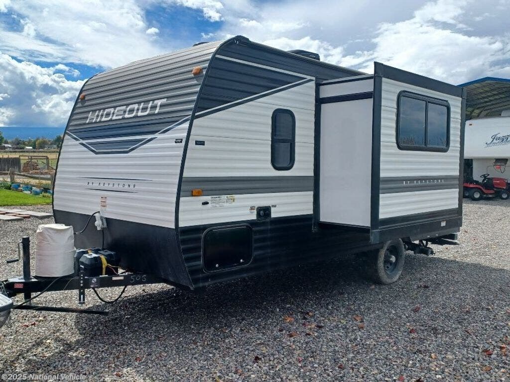 Call now about this 2022 Keystone Hideout 174RK! 2022 Keystone Hideout 174RK - Used Travel Trailer For Sale by National Vehicle in Montrose, Colorado