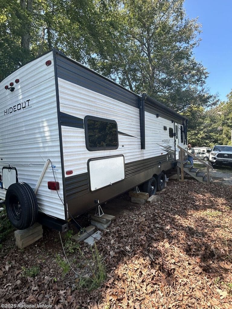 Call now about this 2021 Keystone Hideout 290QB! 2021 Keystone Hideout 290QB - Used Travel Trailer For Sale by National Vehicle in Cumming, Georgia