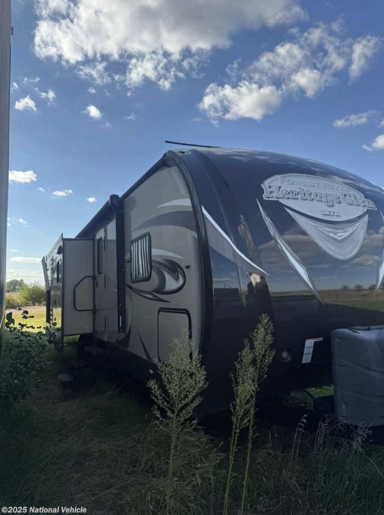 Call now about this 2015 Forest River Wildwood Heritage Glen Lite 272RLIS! 2015 Forest River Wildwood Heritage Glen Lite 272RLIS - Used Travel Trailer For Sale by National Vehicle in Papillion, Nebraska