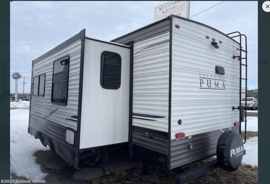 Call now about this 2023 Palomino Puma 25RKQB! 2023 Palomino Puma 25RKQB - Used Travel Trailer For Sale by National Vehicle in Ellijay, Georgia