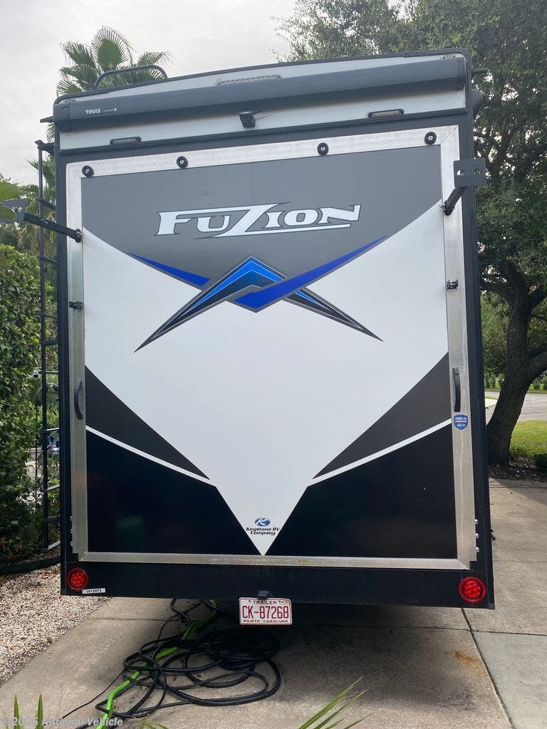 Call now about this 2020 Keystone Fuzion 429! 2020 Keystone Fuzion 429 - Used Toy Hauler For Sale by National Vehicle in Hilton Head Island, South Carolina