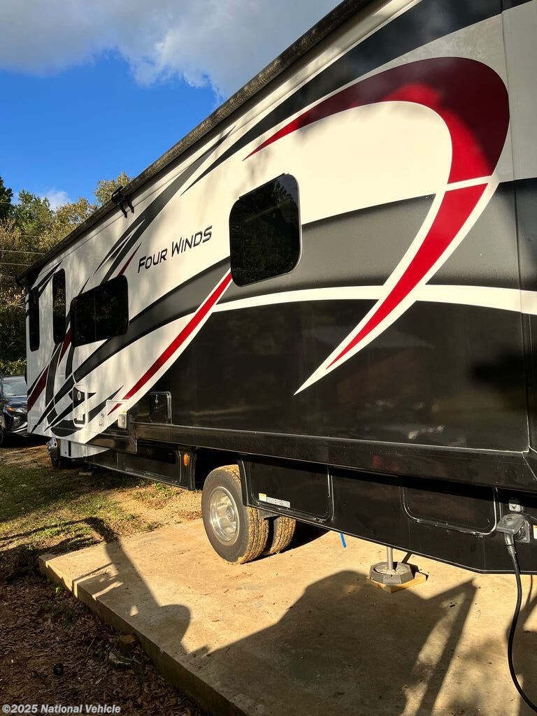 Call now about this 2022 Thor Motor Coach Four Winds 31W! 2022 Thor Motor Coach Four Winds 31W - Used Class C For Sale by National Vehicle in Angie, Louisiana