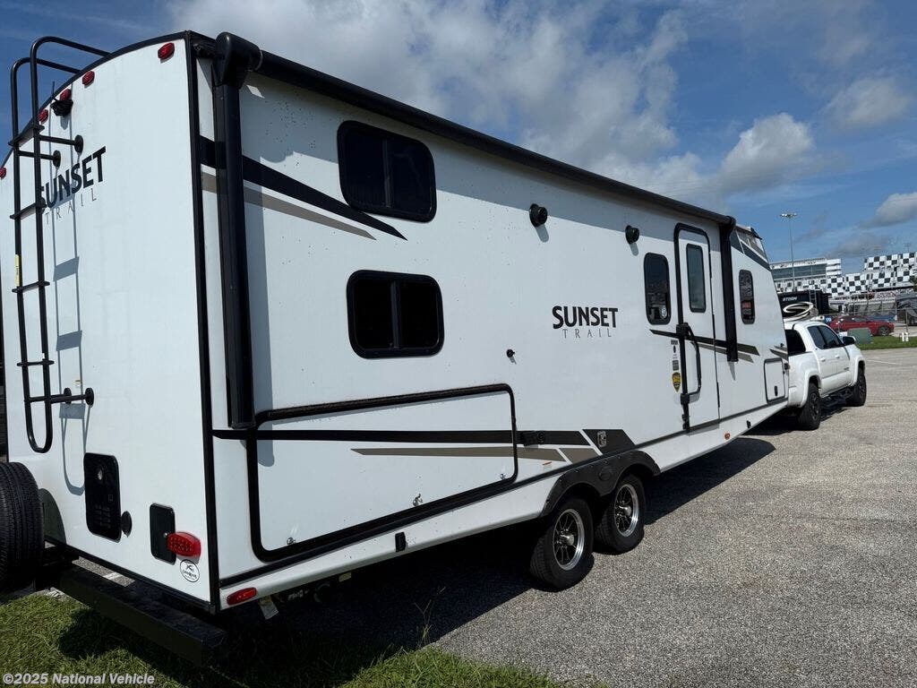 Call now about this 2024 CrossRoads Sunset Trail Super Lite 242BH! 2024 CrossRoads Sunset Trail Super Lite 242BH - Used Travel Trailer For Sale by National Vehicle in Winter Park, Florida
