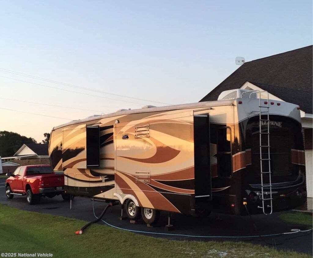 Call now about this 2013 Keystone Alpine 3720FB! 2013 Keystone Alpine 3720FB - Used Fifth Wheel For Sale by National Vehicle in San Antonio, Texas