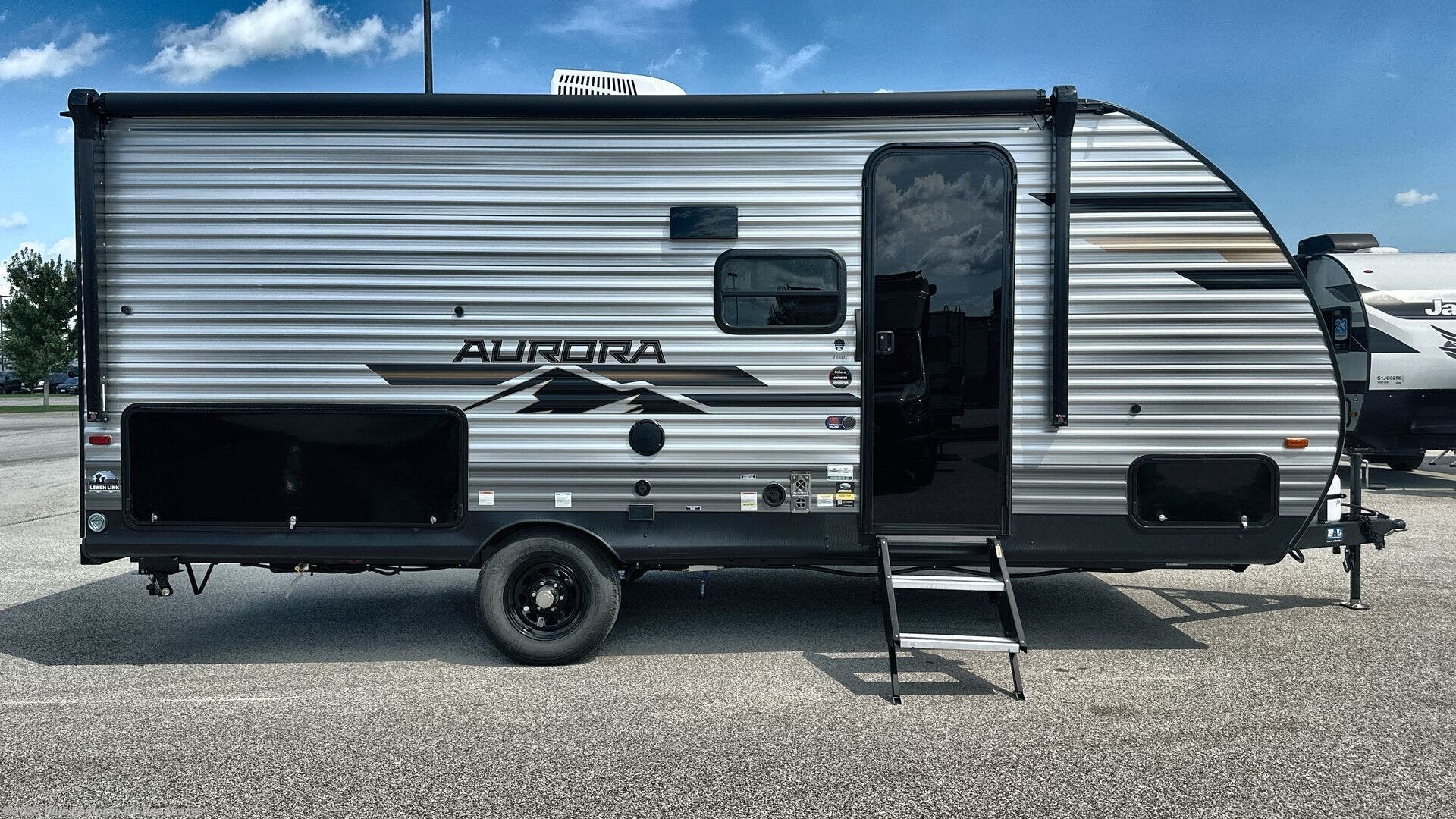 Contact us now about this 2026 Forest River Aurora Light 18BHS! 2026 Aurora Light 18BHS by Forest River from Blue Compass RV Des Moines in Altoona, Iowa