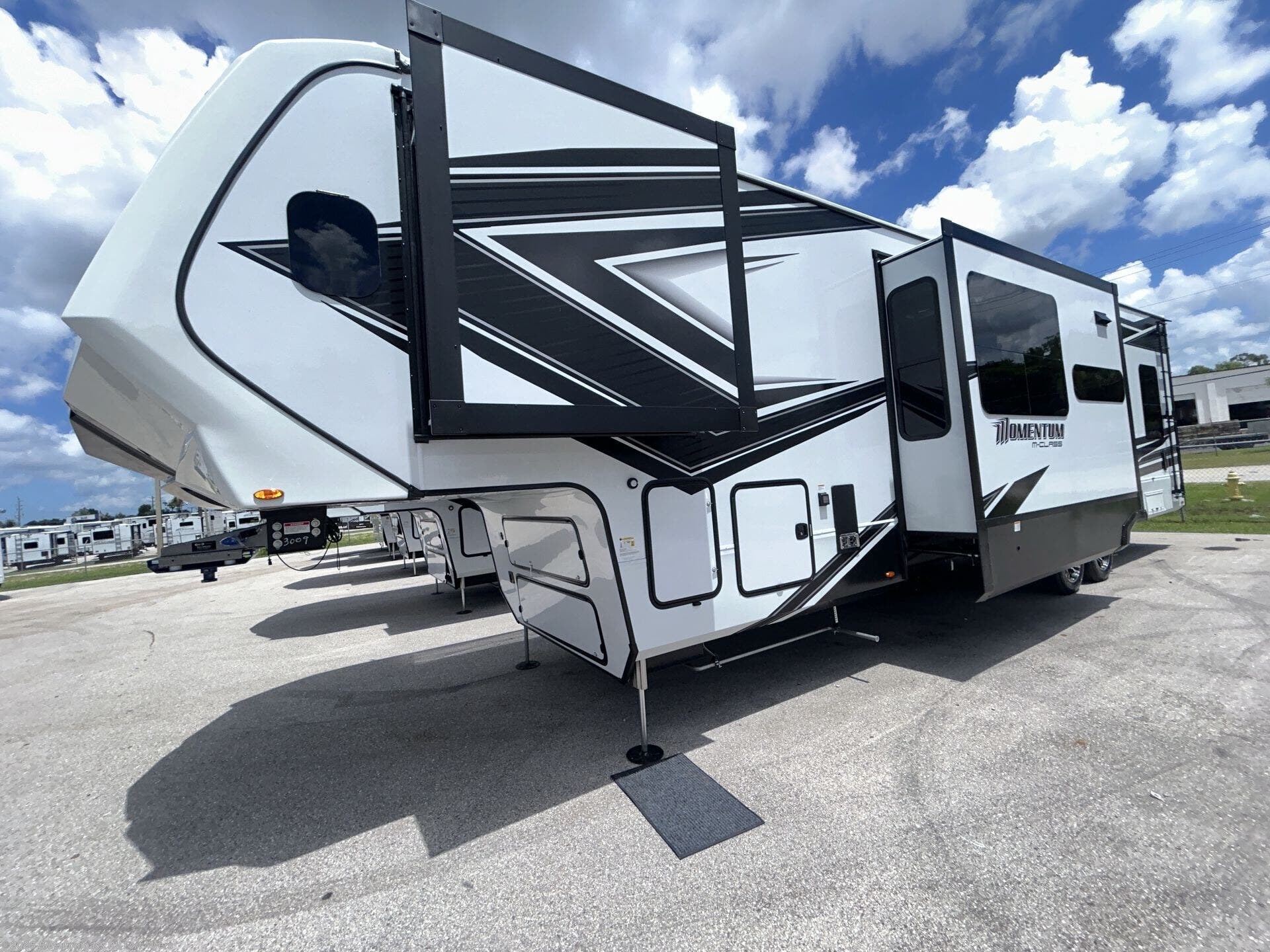 Contact us now about this 2025 Grand Design Momentum M-Class 344M! 2025 Momentum M-Class 344M by Grand Design from Blue Compass RV Fort Myers in Fort Myers, Florida