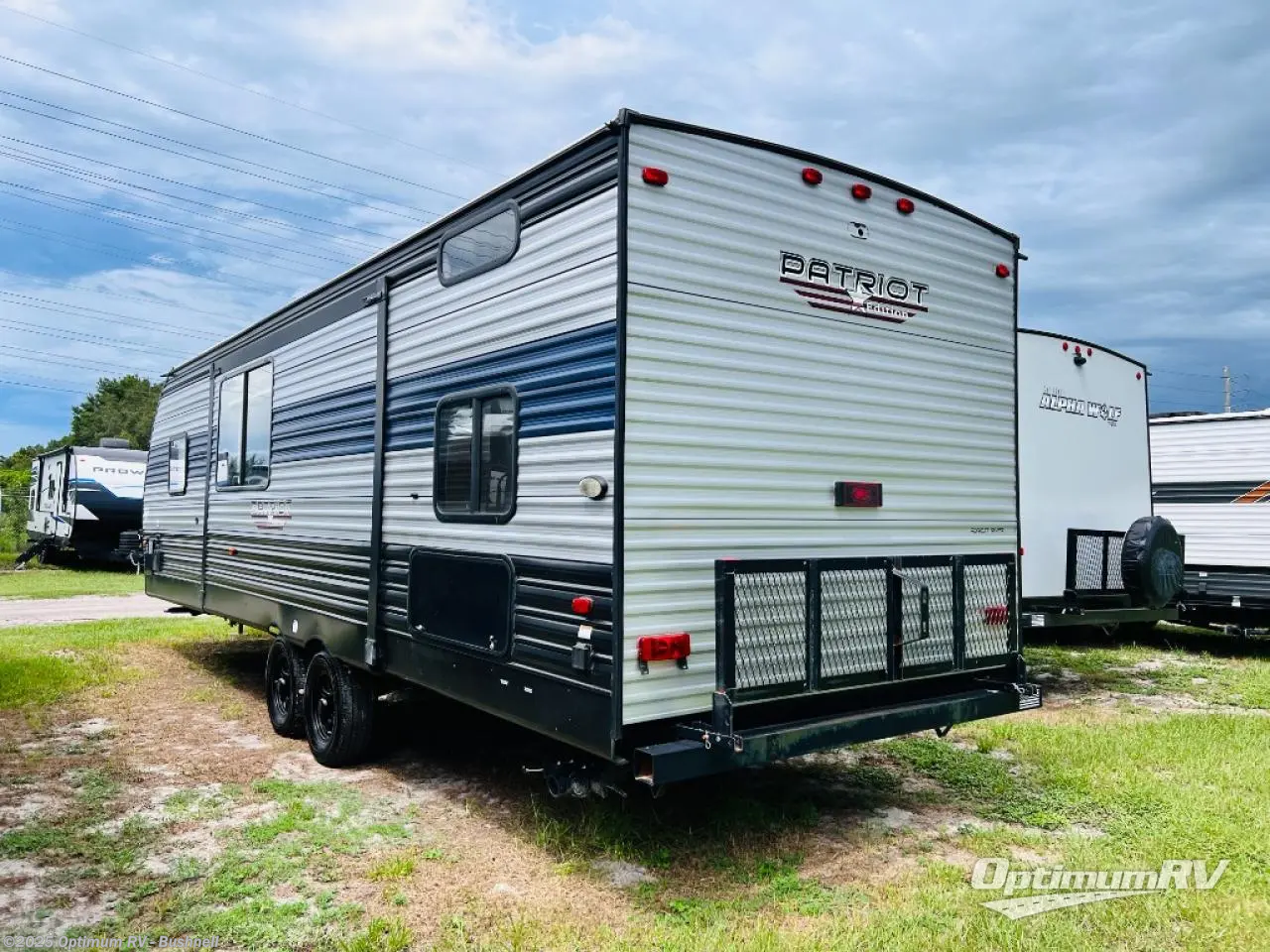 Call now about this 2022 Forest River Patriot Edition 23DBH! 2022 Forest River Patriot Edition 23DBH - Used Travel Trailer For Sale by Optimum RV - Bushnell in Bushnell, Florida features Slideout, Awning