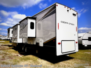 Call now about this 2023 Forest River Cedar Creek 371FL! 2023 Forest River Cedar Creek 371FL - Used Fifth Wheel For Sale by Optimum RV - Bushnell in Bushnell, Florida features Slideout, Awning