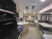 Call now about this 2023 Forest River Wildwood X-Lite 24RLXL! 2023 Forest River Wildwood X-Lite 24RLXL - Used Travel Trailer For Sale by Roughin' It Inc in Madison, Ohio features Shower, Solar Panels, U-Shaped Dinette, Leveling Jacks, Toilet