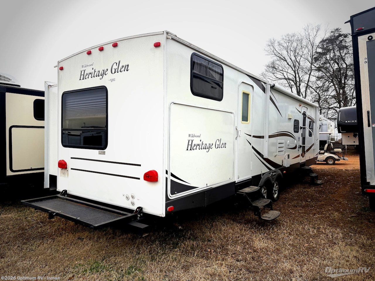 Call now about this 2011 Forest River Wildwood Heritage Glen 312QBUD! 2011 Forest River Wildwood Heritage Glen 312QBUD - Used Travel Trailer For Sale by Optimum RV - Inman in Inman, South Carolina features Slideout