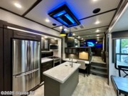 Call now about this 2021 Grand Design Momentum 376THS! 2021 Grand Design Momentum 376THS - Used Fifth Wheel For Sale by Glades RV in Fort Myers, Florida features Automatic Leveling Jacks, Televator TV, Pass Thru Storage, Dryer, Generator