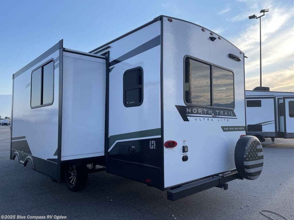 Call now about this 2025 Heartland North Trail 26rlx! 2025 Heartland North Trail 26rlx - Used Travel Trailer For Sale by Blue Compass RV Ogden in Marriott-Slaterville, Utah