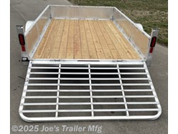 Legend Open Deluxe 7X12 Utility Trailer, 4" Tube Main Frame Utility Trailer, 24" OC Crossmembers Trailer, 15" Side Rails With Skirting, 2" Coupler Trailer, ST205/75R14 Steel Tires Trailer, ATP Fenders Utility Trailer, Treated Wood Decking Trailer, (4) Stake Pockets Utility Trailer, No Brakes Utility Trailer, Load Angle 19° Trailer, Ramp Length 48" Trailer, Ramp Pivot Point Trailer, Heavy Duty Utility Trailer, Durable Utility Trailer, Steel Tires Utility Trailer, Tubular Frame Trailer, Crossmembers Spacing 24" Trailer, Side Rails With Skirting Utility Trailer, Coupler 2" Trailer, Aluminum Fenders Utility Trailer, Wood Decking Treated, Stake Pockets 4 Trailer, Trailer Without Brakes, Load Angle 19 Degrees, Ramp Length 48 Inches, Utility Trailer Specs, Trailer Features, Utility Trailer Specifications, Legend Trailer Features, Deluxe Utility Trailer, Open Utility Trailer Legend Open Deluxe 7X12 Utility Trailer, 4" Tube Main Frame Utility Trailer, 24" OC Crossmembers Trailer, 15" Side Rails With Skirting, 2" Coupler Trailer, ST205/75R14 Steel Tires Trailer, ATP Fenders Utility Trailer, Treated Wood Decking Trailer, (4) Stake Pockets Utility Trailer, No Brakes Utility Trailer, Load Angle 19° Trailer, Ramp Length 48" Trailer, Ramp Pivot Point Trailer, Heavy Duty Utility Trailer, Durable Utility Trailer, Steel Tires Utility Trailer, Tubular Frame Trailer, Crossmembers Spacing 24" Trailer, Side Rails With Skirting Utility Trailer, Coupler 2" Trailer, Aluminum Fenders Utility Trailer, Wood Decking Treated, Stake Pockets 4 Trailer, Trailer Without Brakes, Load Angle 19 Degrees, Ramp Length 48 Inches, Utility Trailer Specs, Trailer Features, Utility Trailer Specifications, Legend Trailer Features, Deluxe Utility Trailer, Open Utility Trailer