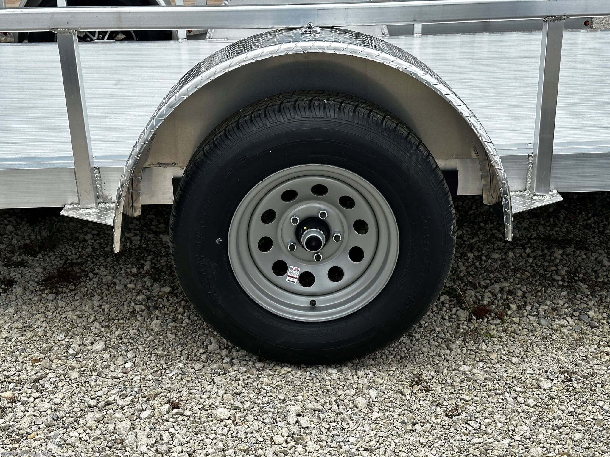 Legend 7X14' Open Deluxe Utility Trailer, 17" Deck Height Utility Trailer, 48" Bi Fold Ramp Gate Trailer, 3.5k EZ-Lube Spring Axle Trailer, ST205/75R14 Silver Mod Steel Tires, 3" Tube Cross Members Trailer, 24" On Center Cross Member Spacing, 4" Tube Frame Utility Trailer, Aluminum Flooring Trailer, LED Lighting Utility Trailer, 2" Straight Coupler Trailer, 2k Top-Wind Jack Utility Trailer, ATP Fenders Trailer, Stake Pockets Utility Trailer, Heavy Duty Utility Trailer, Open Utility Trailer 7X14, Deluxe Utility Trailer with Ramp Gate, Spring Axle Utility Trailer, Steel Tires Utility Trailer, Tube Cross Members Utility Trailer, Cross Member Spacing Utility Trailer, Tube Frame Trailer, Flooring Aluminum Trailer, LED Lights Utility Trailer, Coupler Trailer Parts, Top-Wind Jack Utility Trailer, Fenders ATP Utility Trailer, Stake Pockets Utility Trailer Features