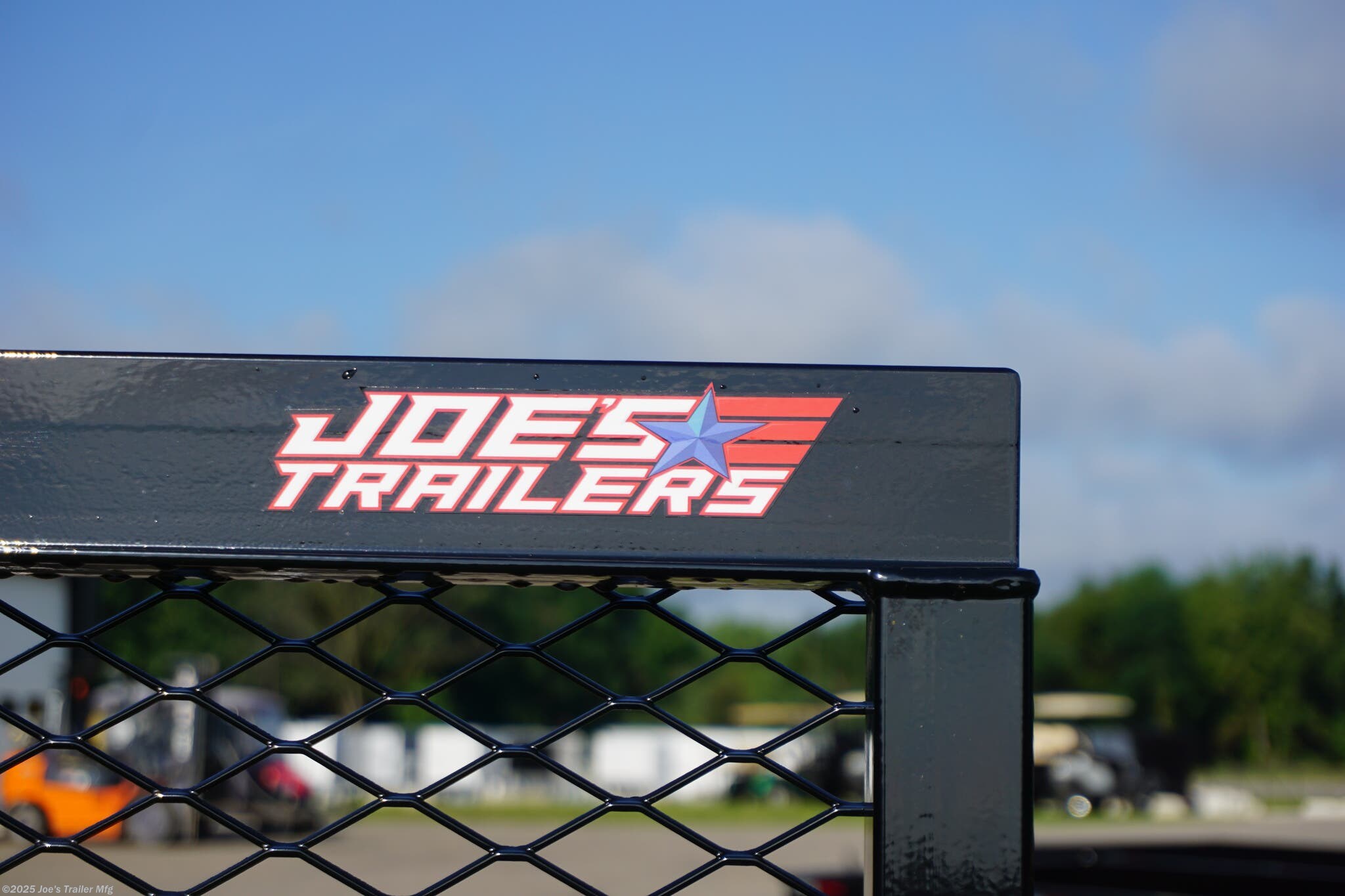 82x20 Tandem Solid Side, 12-Gauge Steel Frame, Steel Angle Crossmembers, 12-Gauge Steel Sides, 15" Tall, 4" Steel Channel Tongue, A-Frame Posi-lock Coupler, Dual Safety Chains and Hooks, 2K Rated Set-Back Jack with Foot, 2x8 Treated, #1 Grade Wood Decking, Welded Front Board Retainer, Welded Rear End Cap, 50" Spring Assisted Gate, Grab Handle, Steel Tread Plate Fenders, Spring Suspension, Easy Lube Hubs, Radial Tires, Black Steel Wheels, Enclosed Sealed Wiring Harness, Full LED Lighting, DOT Compliant Lighting, D-Rings Tie Downs, Spare Tire Mount, Load Angle, Ramp Length, Load Angle: 22°, Ramp Length: 50", ramp pivot point, heavy-duty trailer, utility trailer, equipment trailer, tandem axle trailer, solid side trailer, durable trailer, trailer safety features, easy maintenance trailer, wood decking trailer, radial tire trailer, LED lighting trailer, steel frame trailer, spring suspension trailer, A-frame coupler, safety chains, set-back jack, treated wood decking, spring assisted gate,