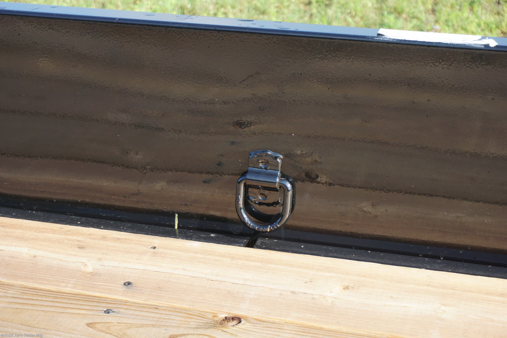 82x20 Tandem Solid Side, 12-Gauge Steel Frame, Steel Angle Crossmembers, 12-Gauge Steel Sides, 15" Tall, 4" Steel Channel Tongue, A-Frame Posi-lock Coupler, Dual Safety Chains and Hooks, 2K Rated Set-Back Jack with Foot, 2x8 Treated, #1 Grade Wood Decking, Welded Front Board Retainer, Welded Rear End Cap, 50" Spring Assisted Gate, Grab Handle, Steel Tread Plate Fenders, Spring Suspension, Easy Lube Hubs, Radial Tires, Black Steel Wheels, Enclosed Sealed Wiring Harness, Full LED Lighting, DOT Compliant Lighting, D-Rings Tie Downs, Spare Tire Mount, Load Angle, Ramp Length, Load Angle: 22°, Ramp Length: 50", ramp pivot point, heavy-duty trailer, utility trailer, equipment trailer, tandem axle trailer, solid side trailer, durable trailer, trailer safety features, easy maintenance trailer, wood decking trailer, radial tire trailer, LED lighting trailer, steel frame trailer, spring suspension trailer, A-frame coupler, safety chains, set-back jack, treated wood decking, spring assisted gate,