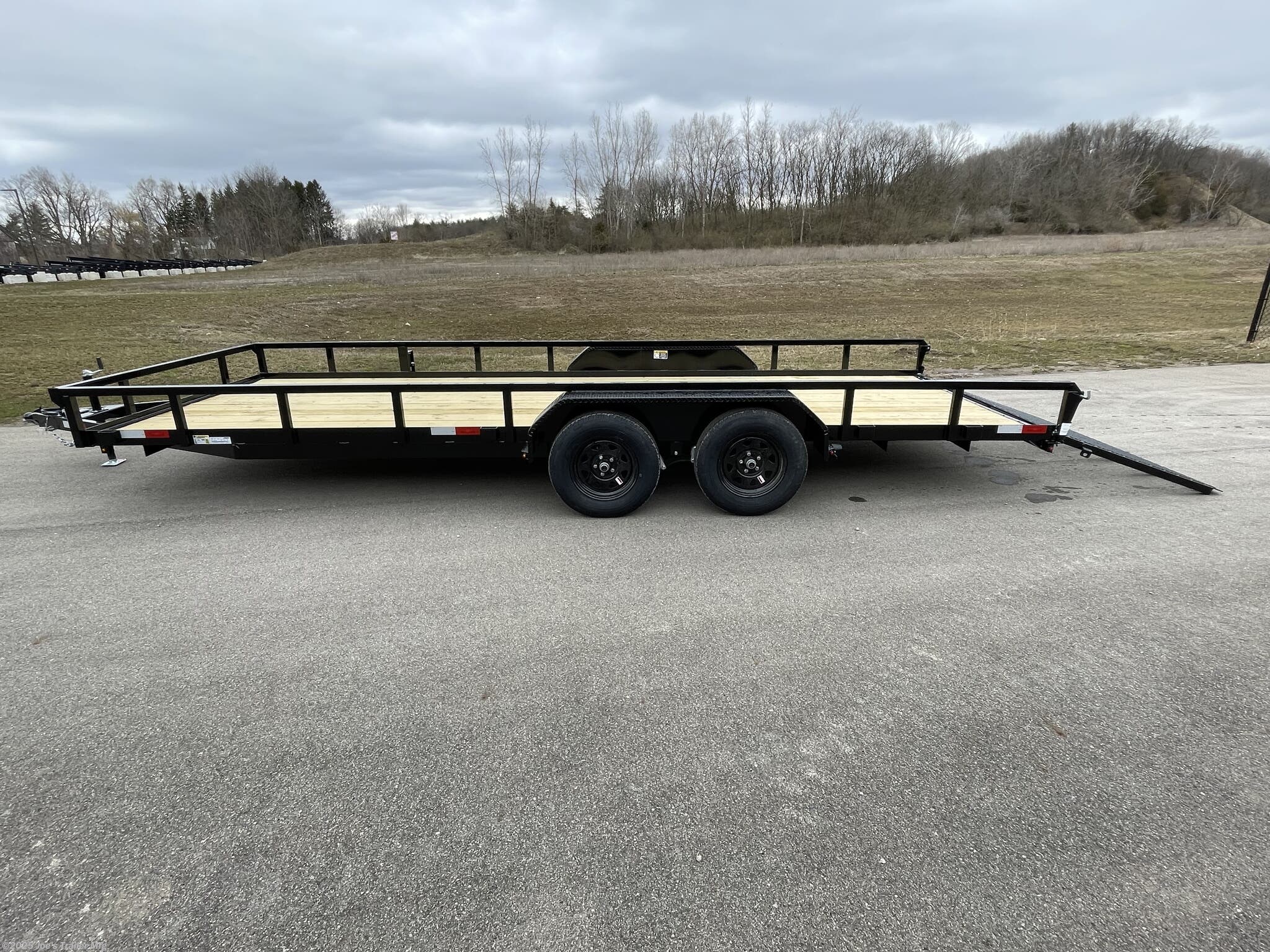 H&H 82" x 18' Landscape/Utility Trailer, H&H Utility Trailer, H&H Landscape Trailer, H&H 82x18 Trailer, 82x18 Utility Trailer, 82x18 Landscape Trailer, Steel Angle Frame Trailer, 3" x 2" Steel Angle Frame, 4" x 3" Steel Angle Frame, Steel Crossmembers, Steel Channel Tongue, Steel Tube Uprights, Steel Tube Top Rail, A-Frame Posi-Lock Coupler, 2" A-Frame Coupler, 2-5/16" A-Frame Coupler, Single Axle Trailer, Tandem Axle Trailer, Dual Safety Chains, Safety Chains and Hooks, 4-Prong Plug, 7-Way RV Plug, Enclosed Wiring Harness, Setback Jack with Foot, Spring Assisted Gate, Tall Spring Gate, Grab Handle, Radius Tread Plate Fenders, Steel Tread Plate Fenders, Spring Idler Suspension, Tandem Spring Brake Suspension, Easy Lube Hubs, ST205/75R15 C Tires, 15" Black Steel Wheels, Powder Coat Finish, Pressure Treated Pine Decking, Welded Front Board Retainer, Rear End Board Cap, Stake Pockets, Spare Tire Mount, Full LED Lighting, DOT Compliant Lighting, Load Angle Ramp Length, 22° Load Angle, 50"