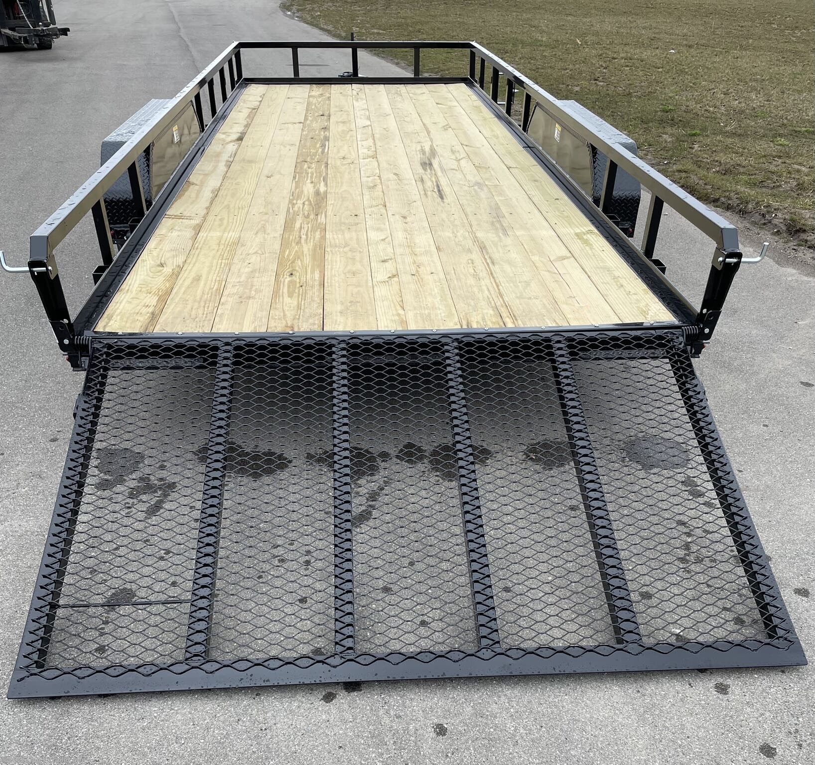 H&H 82" x 20' Landscape Utility Trailer, 3" x 2" x 3/16" Steel Angle Frame, Single Axle Utility Trailer, 4" x 3" x 1/4" Steel Angle Frame, Tandem Axle Utility Trailer, 3" x 2" x 3/16" Steel Angle Crossmembers, 4" Steel Channel Tongue, 2" x 1-1/2" Steel Tube Uprights, 2" x 2" Steel Tube Top Rail, 2" A-Frame Posi-Lock Coupler, Single Axle Coupler, 2-5/16" A-Frame Posi-Lock Coupler, Tandem Axle Coupler, Dual Safety Chains and Hooks, 4-Prong Plug Trailer, 7-Way RV-Style Plug, Enclosed Sealed Wiring Harness, 2k Rated Setback Jack, Spring Assisted Gate, 50" Tall Gate, Grab Handle Gate, Radius Tread Plate Fenders, Steel Formed Tread Plate Fenders, Single Spring Idler Suspension, 2990 lb. GVWR, Tandem Spring Brake Suspension, 7000 lb. GVWR, Easy Lube Hubs, ST205/75R15 'C' Tires, 15" Black Steel Wheels, High Gloss Powder Coat Finish, 2 x 8 Pressure Treated Pine Decking, Welded Front Board Retainer, Rear End Board Cap, Stake Pockets Trailer, Spare Tire Mount, Full LED DOT Compliant Lighting.