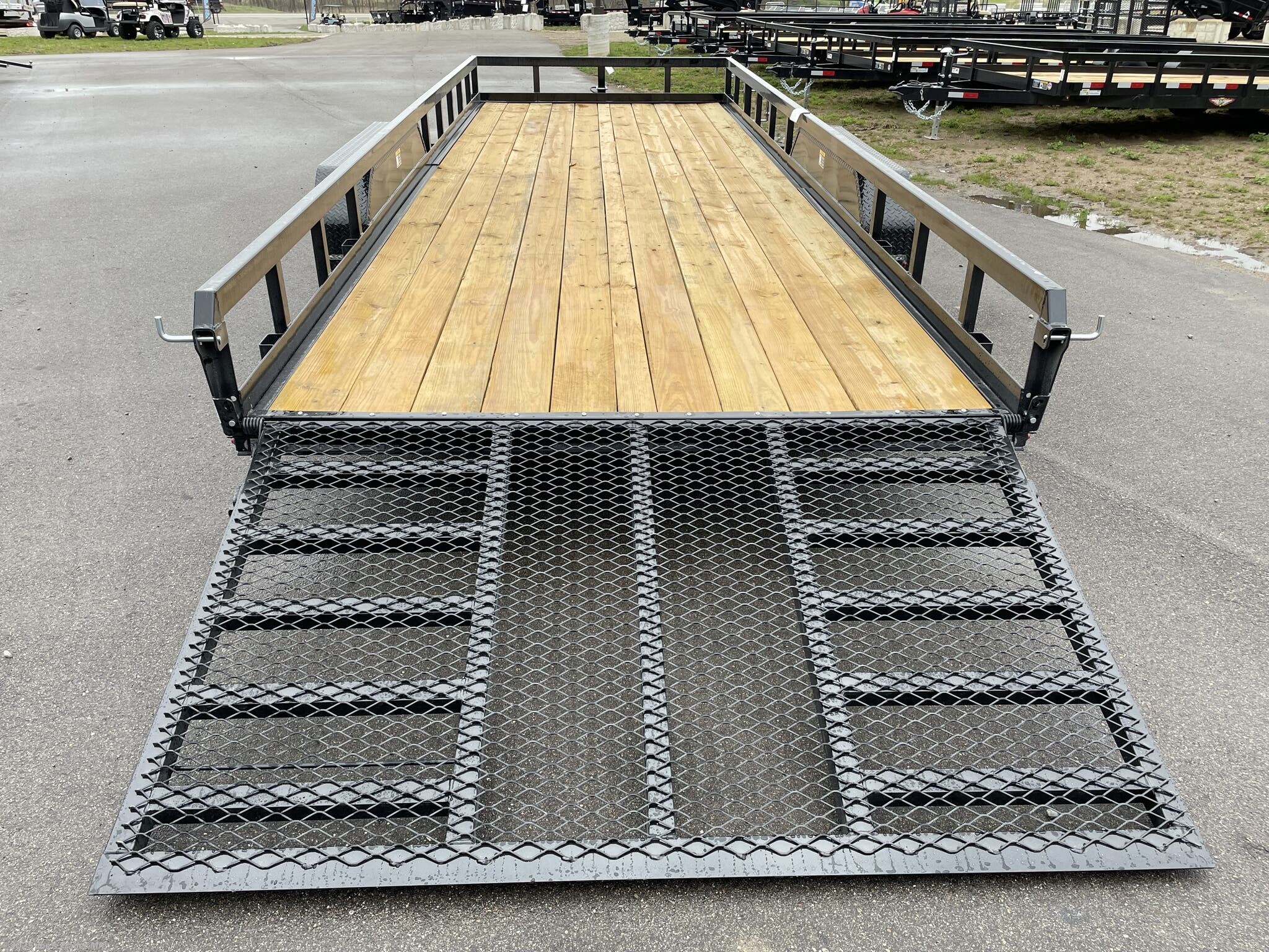 H&H 82" x 22' Heavy Duty Landscape/Utility Trailer, 5" x 3" x 1/4" Steel Angle Frame, 3" x 2" x 3/16" Steel Angle Crossmembers, 5" Steel Channel Tongue, Fully Wrapped, 3" x 2" Steel Tube Top Rail, 2-5/16" A-Frame Posi-Lock Coupler, Dual Safety Chains and Hooks, 7-Way RV-Style Plug, Enclosed Sealed Wiring Harness, 7k Rated Setback Drop Leg Jack, 50" Tall Reinforced Spring Assist Gate, Ladder Style Gate, Steel Formed Tread Plate Fenders, Tandem Spring Brake Suspension, 9900 lb GVWR, Easy Lube Hubs, ST225/75R15 'D' Tires, 15" Black Steel Wheels, Industrial Grade Polymer Finish, 2 x 8 Pressure Treated Pine Decking, Welded Front Board Retainer, Rear End Board Cap, Stake Pockets, Spare Tire Mount, Full LED DOT Compliant Lighting, Heavy Duty Utility Trailer, Landscape Trailer, Steel Angle Frame Trailer, Heavy Duty Trailer, Landscape Utility Trailer, Tandem Axle Utility Trailer, Spring Assist Gate Trailer, Steel Channel Tongue Trailer, Pressure Treated Pine Deck Trailer, Black Steel Wheels Tra
